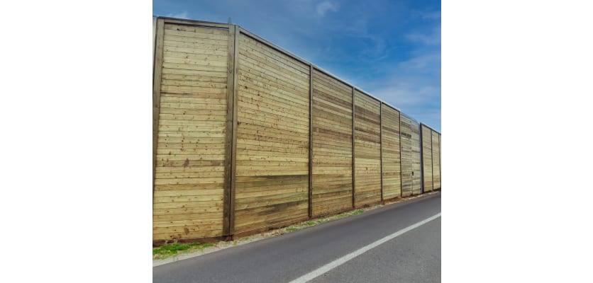 EchoGroove Reflective Acoustic Fencing Kit next to roadside barriers