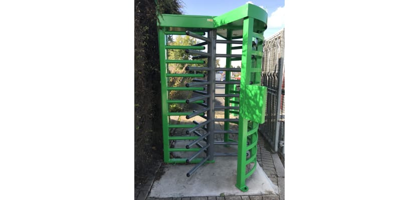 A Green and Grey Finished 3 Wing Single Turnstile with Overhead Canopy