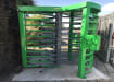 A Green and Grey Finished 3 Wing Single Turnstile with Overhead Canopy