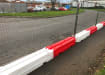 A line of Rota Slot Ballast Barriers with temporary fencing panels 