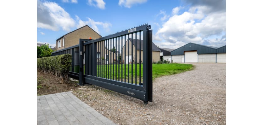 A black FFL 95 Manual Cantilever Gate securing a private home 