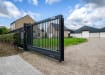 A black FFL 95 Manual Cantilever Gate securing a private home 