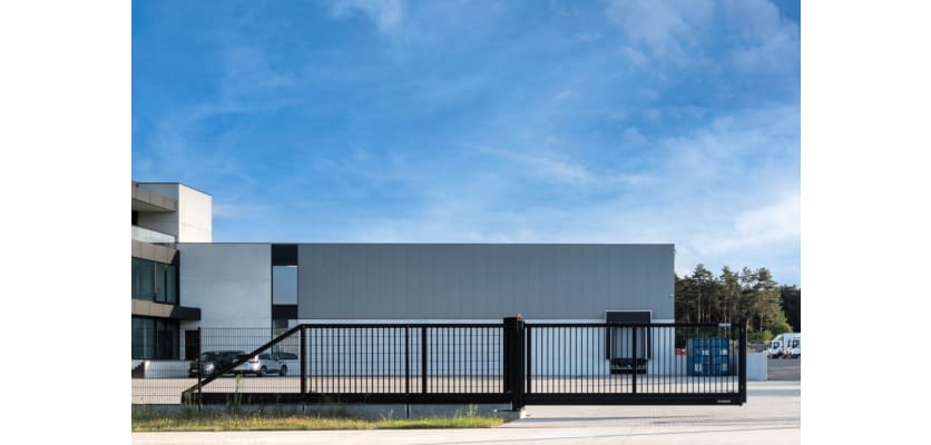 A black FFL 200 Cantilever gate outside an office building 