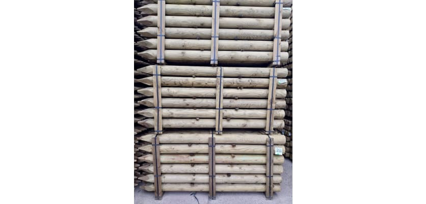 Tanalised timber posts in storage