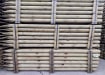 Tanalised wooden posts in storage