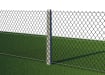 Concrete intermediate post supporting chain link fencing
