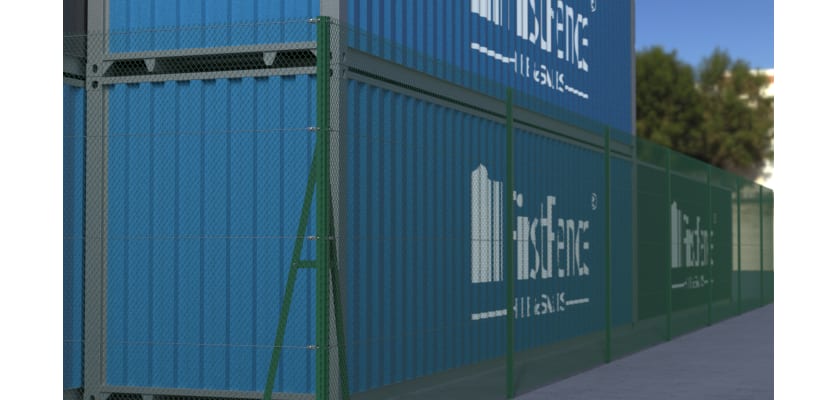Green chain link fencing installed around warehouse