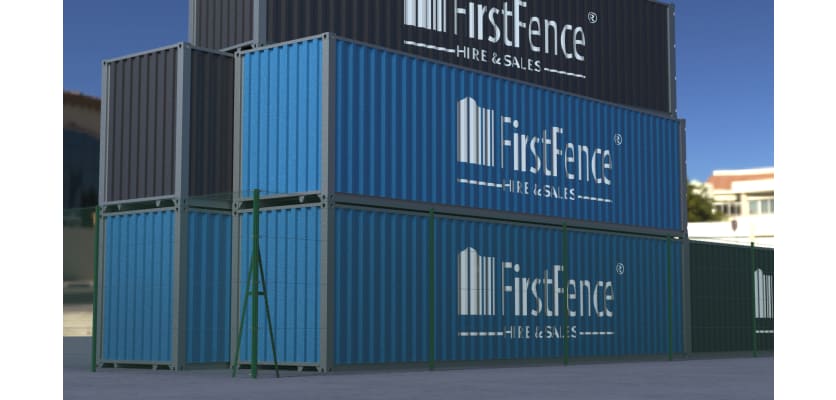 Green chain link fencing installed around storage containers 