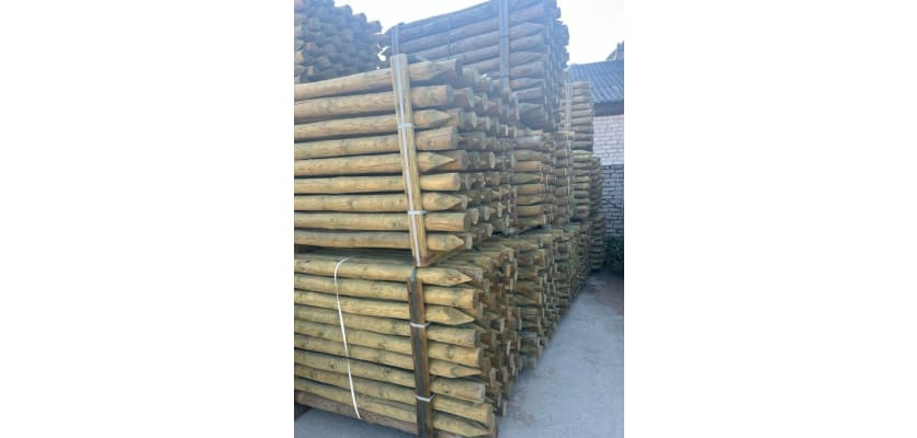 Tanalised timber posts in storage