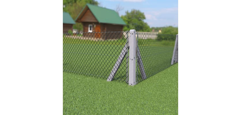 Corner concrete post with chain link fencing, installed on a small farm