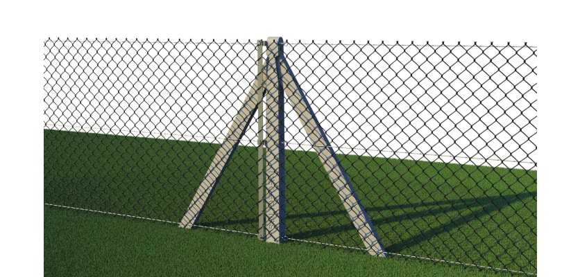 Close up of chain link mesh fencing with concrete posts installed around field