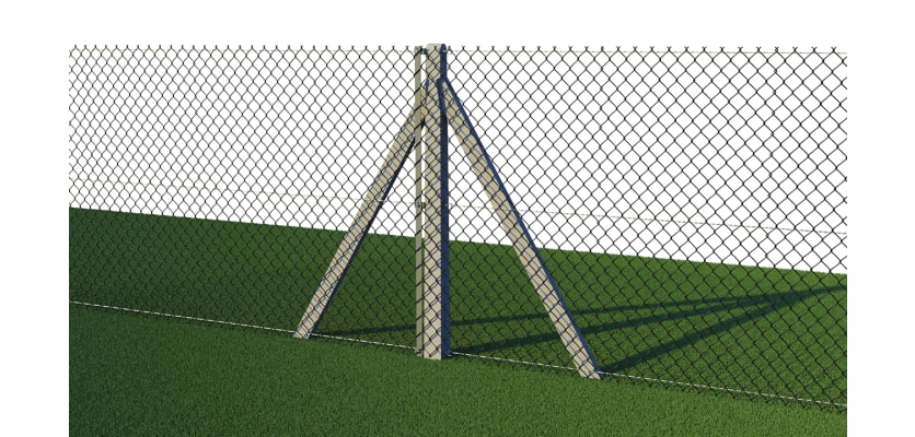 Concrete posts with green chain link mesh installed around field 