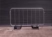 Standard crowd control barrier with two ballast bags attached