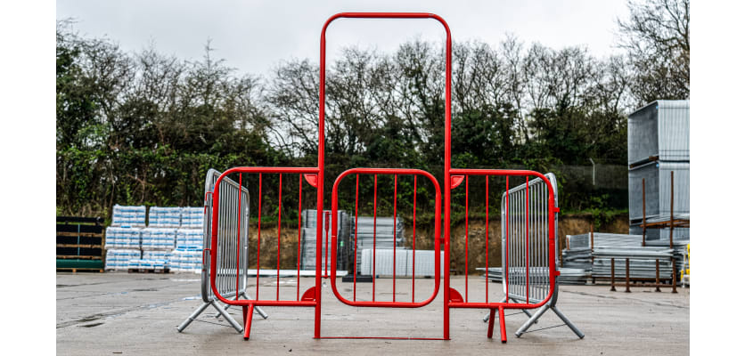 Walk-through barrier with gate attached to crowd control barriers