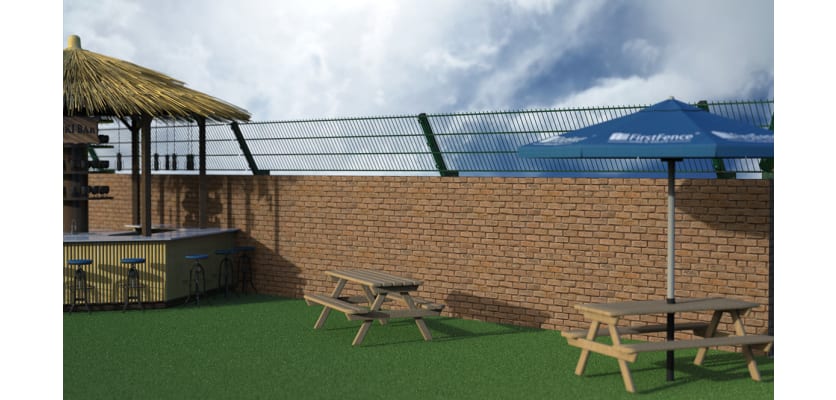 Outdoor reception area with a brick wall, and mesh fence addition mounted to the wall at a 60 degree angle