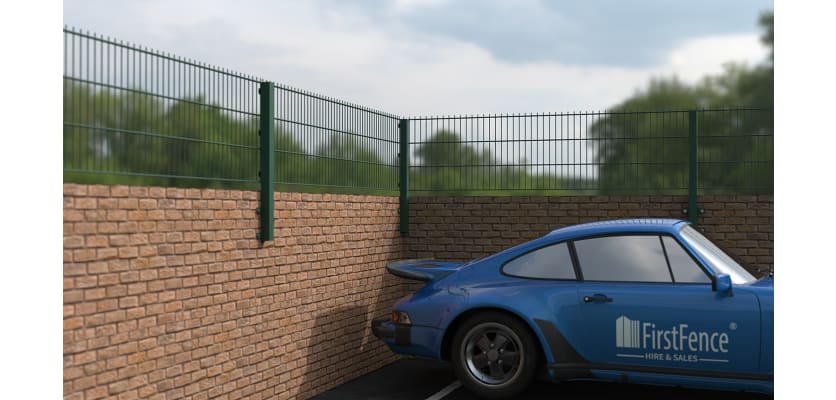 0.6m high wall mounted 868 mesh fencing in green surrounding a car park