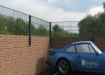 0.6m high wall mounted 868 mesh fencing in green surrounding a car park