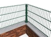 A corner showing the bolt down corner post for the 0.6m High 90 Degree Crank Wall mounted Fencing System