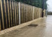 Timber acoustic fencing installed on a commercial property near a busy road