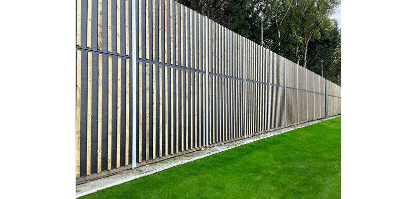 Timber Echo Absorb acoustic fencing on a private property line