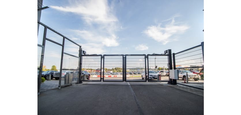 A RapidFold Double Leaf Bi-Fold Gate installed outside a private car park