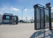 A RapidFold Pro Single Leaf Bi-Fold Gate installed outside of a business park