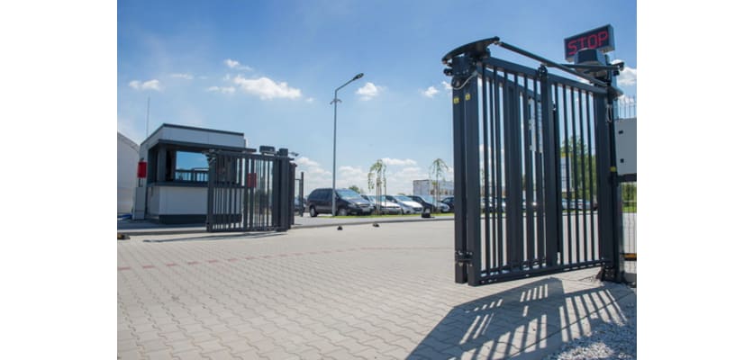 A FFL RapidFold Pro Automatic Bi Fold Gate securing a business site