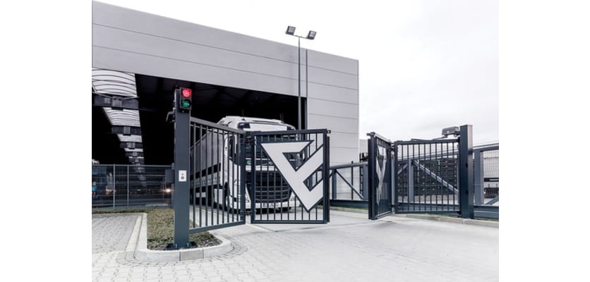 A FFL RapidFold Pro Double Leaf Gate outside of a Storage Depot