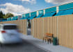 AcoustiGuard® fencing and gate installed near a busy road
