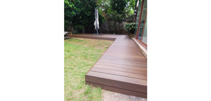 A Decked area of a garden made using Bambura Wood Plastic Composite Decking 