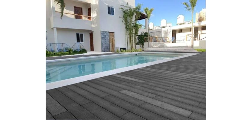 Charcoal Finish Bambura Composite Wood Decking around a pool