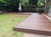 Chocolate-colored Bambura® Wood Plastic Composite essential deck board, showcasing its smooth finish and durability for outdoor decking.