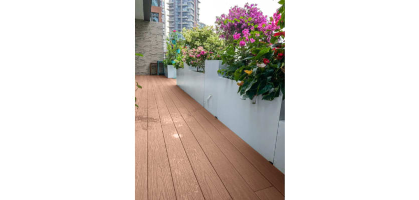 Chocolate-coloured Bambura® wood plastic composite essential deck board showcasing a textured surface and durable design.