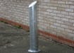 Galvanised mitre top bollard with a sleek silver finish, designed for effective traffic and pedestrian management.