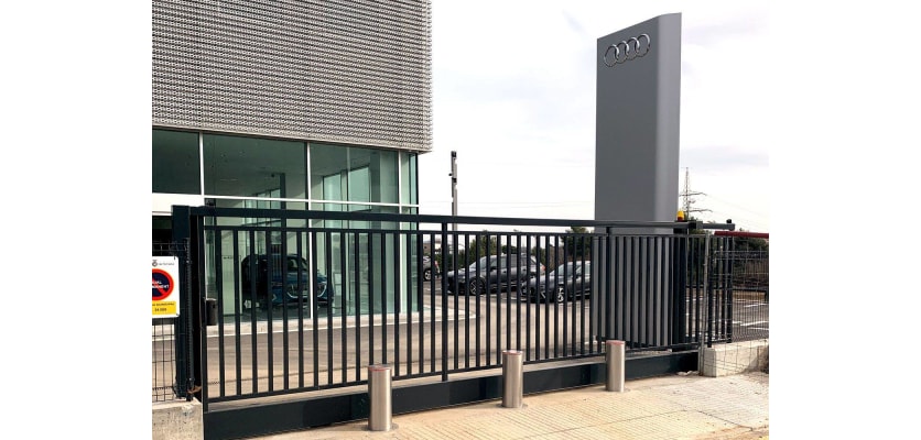 Three Benito H6008 Stainless Steel Automatic Telescopic Hydraulic Bollards installed outside gate