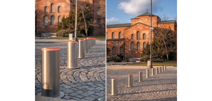 Group of three stainless steel automatic telescopic hydraulic bollards with a modern design, showcasing their sleek finish and functional features for efficient traffic management.