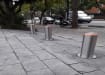 Group of three Stainless Steel Automatic Telescopic Hydraulic Bollard Kit installed outside pavement 
