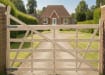 A Sawn Timber Ranch Gate Installed outside a house 