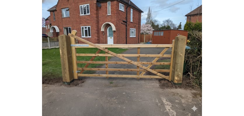 A 1.2m High Sawn Softwood Timber Range Gate outside of a house