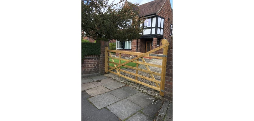 A 1.2m High PAR Softwood Timber Ranch Gate installed outside a house