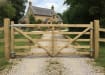 A 1.2m High Sawn Softwood Timber Field Gate securing a Driveway