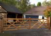 A 1.2m High Iroko Hardwood Timber Field Gate outside a house