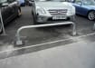 Removable hooped barrier installed in a car park