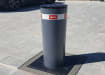 An Installed BFT Stoppy B 700 Automatic Bollard - Grey Finish