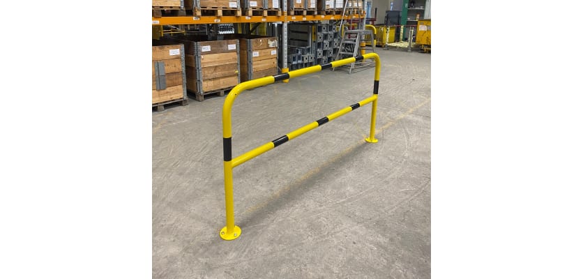 48mm diameter black and yellow hopped barrier installed in a warehouse
