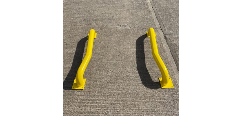 Two yellow cranked wheel guide