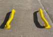 Two yellow cranked wheel guide