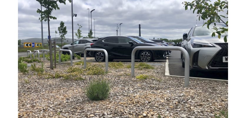 Galvanised hooped barriers installed in a car park