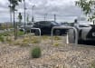 Galvanised hooped barriers installed in a car park