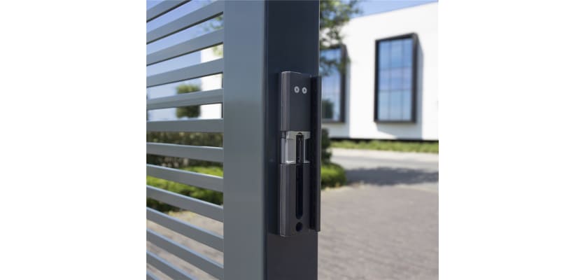 Grey finish Locinox Modulec-SA Surface Mounted Electric Strike installed on a gate